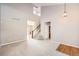 Open living room with high ceilings, staircase, and wood floors at 2856 Penstemon Way, Castle Rock, CO 80109