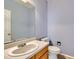 This powder room features a large mirror and updated fixtures at 2856 Penstemon Way, Castle Rock, CO 80109