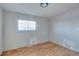 Bright bedroom with hardwood floors and a window at 13643 E Exposition Ave, Aurora, CO 80012