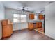 Dining area adjacent to the kitchen, with wood flooring at 13643 E Exposition Ave, Aurora, CO 80012