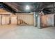 Unfinished basement with exposed framing, plumbing, and a water heater at 7616 S Sicily Way, Aurora, CO 80016