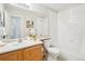 Bathroom with tub, toilet, and double vanity at 7616 S Sicily Way, Aurora, CO 80016