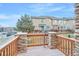 Private deck with stone accents and railing at 7616 S Sicily Way, Aurora, CO 80016