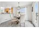 Bright dining area with a table for four and access to a deck at 7616 S Sicily Way, Aurora, CO 80016