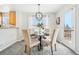 Charming dining area with a table for four and access to a deck at 7616 S Sicily Way, Aurora, CO 80016