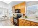 Modern kitchen with ample counter space and wood cabinets at 7616 S Sicily Way, Aurora, CO 80016