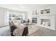 Spacious living room with fireplace and lots of natural light at 7616 S Sicily Way, Aurora, CO 80016