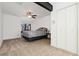 Comfortable bedroom featuring a ceiling fan and natural light from the window at 9400 E Iliff Ave # 37, Denver, CO 80231