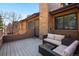 Relaxing outdoor deck with comfortable wicker seating and views of the surrounding neighborhood at 9400 E Iliff Ave # 37, Denver, CO 80231