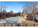 Community pool area with houses in background at 9400 E Iliff Ave # 37, Denver, CO 80231
