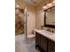 Elegant bathroom featuring a walk-in shower with tiled accents, modern fixtures, and a stylish vanity for a spa-like experience at 45 Oak Way, Evergreen, CO 80439