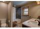 Well-appointed bathroom featuring a tub-shower combo, stylish vanity, and modern fixtures, offering both comfort and convenience at 45 Oak Way, Evergreen, CO 80439
