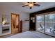 Inviting bedroom offering a private balcony with stunning views, alongside an ensuite bathroom for added convenience at 45 Oak Way, Evergreen, CO 80439