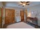 Bedroom with desk, upholstered bed, ceiling fan and walk-in closet at 45 Oak Way, Evergreen, CO 80439