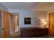 Bright bedroom with wooden furniture and décor, featuring hardwood floors and natural light at 45 Oak Way, Evergreen, CO 80439