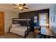 Bedroom featuring bunk beds, ceiling fan, desk area, and natural light from the window at 45 Oak Way, Evergreen, CO 80439
