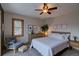 Bright bedroom featuring a ceiling fan, neutral color palette, and a comfortable layout, perfect for relaxation at 45 Oak Way, Evergreen, CO 80439