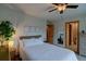 Serene bedroom with warm lighting, a plush bed, and minimalist decor for a peaceful retreat at 45 Oak Way, Evergreen, CO 80439
