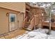 Inviting entrance featuring stone accents, wooden stairs and a covered doorway at 45 Oak Way, Evergreen, CO 80439