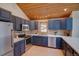 Well-equipped kitchen with stainless steel appliances, sleek countertops, and custom cabinetry, offering both style and functionality at 45 Oak Way, Evergreen, CO 80439