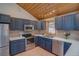 A well-appointed kitchen with stainless steel appliances, granite countertops, and ample cabinet space at 45 Oak Way, Evergreen, CO 80439