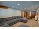 Expansive living room with a large sectional sofa and dining area, great for entertaining guests at 45 Oak Way, Evergreen, CO 80439