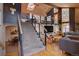 Spacious living room with staircase, wood accents, and comfortable seating at 45 Oak Way, Evergreen, CO 80439