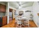Bright dining area with white table, chairs and adjacent kitchen access at 615 Estes St, Lakewood, CO 80215