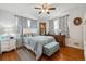 Charming main bedroom with stylish decor, hardwood floors, and large windows at 615 Estes St, Lakewood, CO 80215