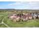 Beautiful aerial shot of a neighborhood with views of the surrounding area, open green spaces, and a walking trail at 10705 Pinewalk Way, Highlands Ranch, CO 80130