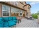 Expansive outdoor deck with a blue sectional, a dining table, and outdoor seating at 10705 Pinewalk Way, Highlands Ranch, CO 80130