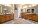 Spacious bathroom features double vanities, neutral tile, and a separate water closet for added privacy at 10705 Pinewalk Way, Highlands Ranch, CO 80130