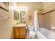 Cozy bathroom features a single vanity, tub/shower combo, and neutral color palette at 10705 Pinewalk Way, Highlands Ranch, CO 80130