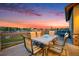 Outdoor living space featuring a dining table, chairs, and lounge area with views of the surrounding neighborhood at 10705 Pinewalk Way, Highlands Ranch, CO 80130