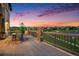 Outdoor living space features a dining table, chairs, and views of the surrounding neighborhood at 10705 Pinewalk Way, Highlands Ranch, CO 80130