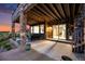 Spacious outdoor patio with room for seating, with backyard access and a beautiful stone exterior at 10705 Pinewalk Way, Highlands Ranch, CO 80130