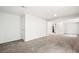 A large basement with neutral colored walls and plush carpeting at 9753 Gatesbury Cir, Highlands Ranch, CO 80126