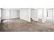 A large basement with carpeted flooring and neutral painted walls at 9753 Gatesbury Cir, Highlands Ranch, CO 80126