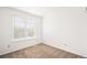 Bright, carpeted bedroom featuring a large window at 9753 Gatesbury Cir, Highlands Ranch, CO 80126