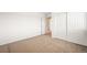 The carpeted bedroom features a double door closet for easy storage at 9753 Gatesbury Cir, Highlands Ranch, CO 80126