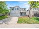 Charming two-story home with a well-maintained lawn and inviting front porch at 9753 Gatesbury Cir, Highlands Ranch, CO 80126