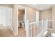 Upstairs hallway with view into bathroom at 9753 Gatesbury Cir, Highlands Ranch, CO 80126