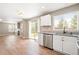 Bright kitchen boasts stainless steel appliances, granite countertops, and backyard access at 9753 Gatesbury Cir, Highlands Ranch, CO 80126