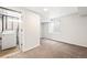 Laundry room featuring new washer, window, and neutral carpet flooring at 9753 Gatesbury Cir, Highlands Ranch, CO 80126