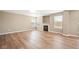Spacious living room featuring fireplace and large windows at 9753 Gatesbury Cir, Highlands Ranch, CO 80126