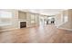 Open-concept living space includes fireplace, kitchen, and dining area at 9753 Gatesbury Cir, Highlands Ranch, CO 80126