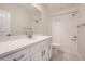 Bathroom featuring granite countertops, brushed nickel hardware, and a shower with a tub at 1807 Grayside Cir, Castle Rock, CO 80109