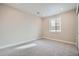 Bedroom with neutral paint and carpet, window with natural light, and trim at 1807 Grayside Cir, Castle Rock, CO 80109