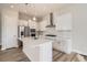 This modern kitchen features white cabinets, stainless steel appliances, and a large island at 1807 Grayside Cir, Castle Rock, CO 80109