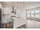 This modern kitchen features white cabinets, stainless steel appliances, and a large island at 1807 Grayside Cir, Castle Rock, CO 80109